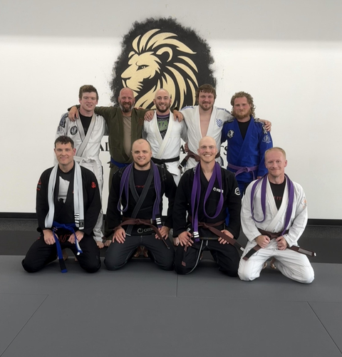 Adults practicing Jiu Jitsu